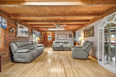 Discover a light-filled Jim Barna log home designed for quiet on Heatherhurst Golf Course in Tennessee - for sale on GolfHomes.com, golf home, golf lot