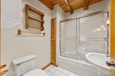 Discover a light-filled Jim Barna log home designed for quiet on Heatherhurst Golf Course in Tennessee - for sale on GolfHomes.com, golf home, golf lot