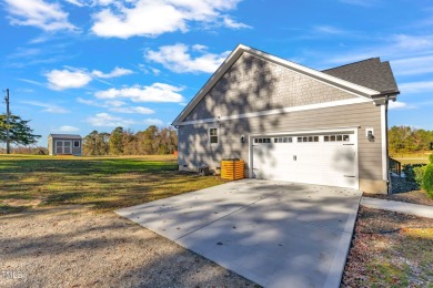 This beautifully UPGRADED like-new home on an acre lot is only on Kerr Lake Country Club in North Carolina - for sale on GolfHomes.com, golf home, golf lot