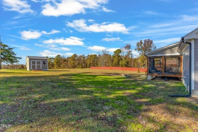 This beautifully UPGRADED like-new home on an acre lot is only on Kerr Lake Country Club in North Carolina - for sale on GolfHomes.com, golf home, golf lot