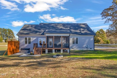 This beautifully UPGRADED like-new home on an acre lot is only on Kerr Lake Country Club in North Carolina - for sale on GolfHomes.com, golf home, golf lot