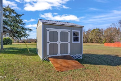 This beautifully UPGRADED like-new home on an acre lot is only on Kerr Lake Country Club in North Carolina - for sale on GolfHomes.com, golf home, golf lot