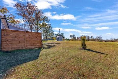 This beautifully UPGRADED like-new home on an acre lot is only on Kerr Lake Country Club in North Carolina - for sale on GolfHomes.com, golf home, golf lot