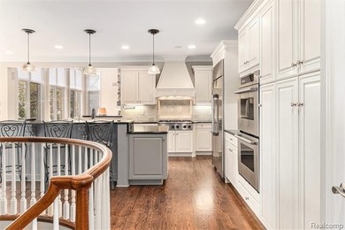 Perched gracefully above the landscape, this Oakhurst residence on Oakhurst Golf and Country Club in Michigan - for sale on GolfHomes.com, golf home, golf lot