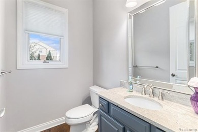 Perched gracefully above the landscape, this Oakhurst residence on Oakhurst Golf and Country Club in Michigan - for sale on GolfHomes.com, golf home, golf lot