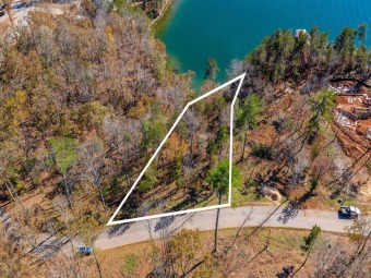 This gentle sloped homesite is tucked away in a small cove with on The Reserve At Lake Keowee in South Carolina - for sale on GolfHomes.com, golf home, golf lot