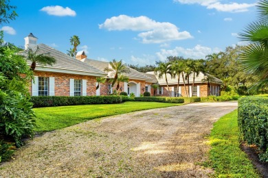 Elegant brick ranch-style estate sits on a meticulously on Country Club of Florida in Florida - for sale on GolfHomes.com, golf home, golf lot