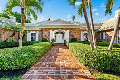 Elegant brick ranch-style estate sits on a meticulously on Country Club of Florida in Florida - for sale on GolfHomes.com, golf home, golf lot