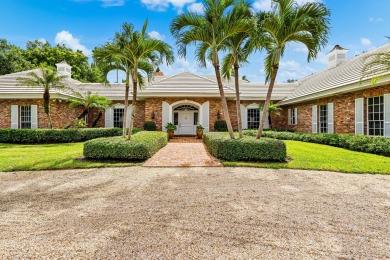 Elegant brick ranch-style estate sits on a meticulously on Country Club of Florida in Florida - for sale on GolfHomes.com, golf home, golf lot