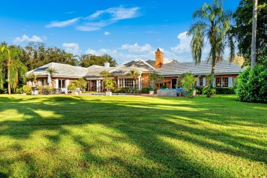 Elegant brick ranch-style estate sits on a meticulously on Country Club of Florida in Florida - for sale on GolfHomes.com, golf home, golf lot