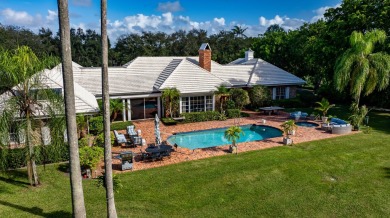 Elegant brick ranch-style estate sits on a meticulously on Country Club of Florida in Florida - for sale on GolfHomes.com, golf home, golf lot