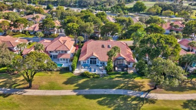 This retreat in the village of Cedar Cay blends its on Broken Sound Golf and Club  in Florida - for sale on GolfHomes.com, golf home, golf lot