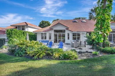 This retreat in the village of Cedar Cay blends its on Broken Sound Golf and Club  in Florida - for sale on GolfHomes.com, golf home, golf lot