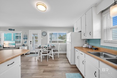 Beautiful, classic beach cottage on Mobile Bay with an on Kiva Dunes Golf Club in Alabama - for sale on GolfHomes.com, golf home, golf lot