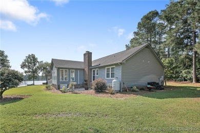 Charming Waterfront Ranch ,on a quiet cul-de-sac, in the gated on Carolina Lakes Country Club in North Carolina - for sale on GolfHomes.com, golf home, golf lot
