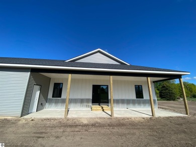 Come take a look at this brand new build with top level finishes on Mistwood Golf Course in Michigan - for sale on GolfHomes.com, golf home, golf lot