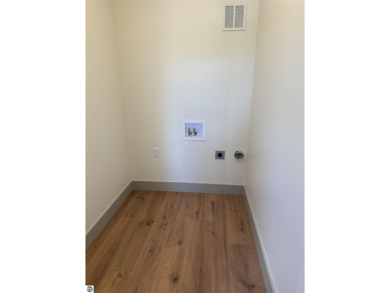 Come take a look at this brand new build with top level finishes on Mistwood Golf Course in Michigan - for sale on GolfHomes.com, golf home, golf lot