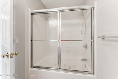 Welcome to your coastal retreat! This spacious 2-bedroom on Brunswick Plantation and Golf Resorts in North Carolina - for sale on GolfHomes.com, golf home, golf lot