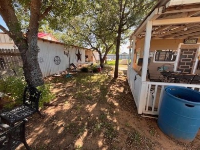 An entire half block is included with this home, perfect for on Rotan Golf Club in Texas - for sale on GolfHomes.com, golf home, golf lot