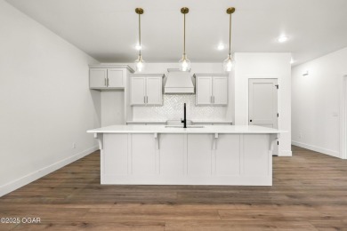 Welcome to 4402 Par Ln, a beautifully designed new construction on Twin Hills Golf and Country Club in Missouri - for sale on GolfHomes.com, golf home, golf lot