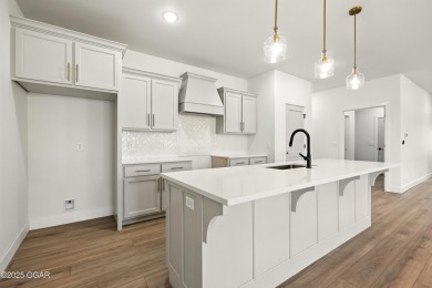 Welcome to 4402 Par Ln, a beautifully designed new construction on Twin Hills Golf and Country Club in Missouri - for sale on GolfHomes.com, golf home, golf lot
