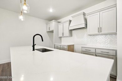 Welcome to 4402 Par Ln, a beautifully designed new construction on Twin Hills Golf and Country Club in Missouri - for sale on GolfHomes.com, golf home, golf lot