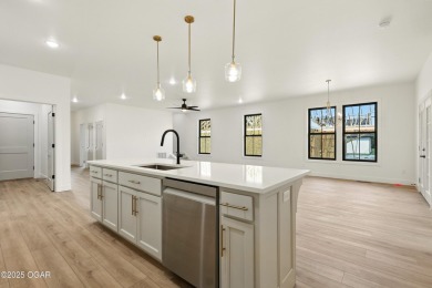 Welcome to 4402 Par Ln, a beautifully designed new construction on Twin Hills Golf and Country Club in Missouri - for sale on GolfHomes.com, golf home, golf lot