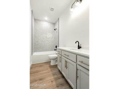 Welcome to 4402 Par Ln, a beautifully designed new construction on Twin Hills Golf and Country Club in Missouri - for sale on GolfHomes.com, golf home, golf lot