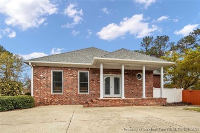 This charming brick home is nestled on the 17th fairway of on Cypress Lakes Golf Course in North Carolina - for sale on GolfHomes.com, golf home, golf lot