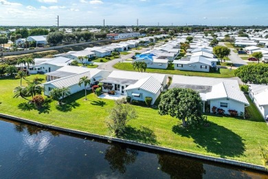 Canalfront Charm in Leisureville! Step into easygoing living on Leisureville Community Golf Course in Florida - for sale on GolfHomes.com, golf home, golf lot