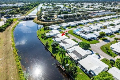 Canalfront Charm in Leisureville! Step into easygoing living on Leisureville Community Golf Course in Florida - for sale on GolfHomes.com, golf home, golf lot