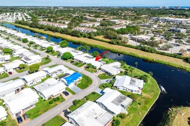 Canalfront Charm in Leisureville! Step into easygoing living on Leisureville Community Golf Course in Florida - for sale on GolfHomes.com, golf home, golf lot