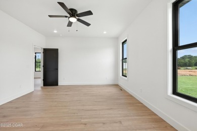 Welcome to 4308 Par Ln, a beautifully designed new construction on Twin Hills Golf and Country Club in Missouri - for sale on GolfHomes.com, golf home, golf lot