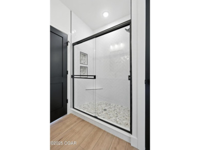Welcome to 4308 Par Ln, a beautifully designed new construction on Twin Hills Golf and Country Club in Missouri - for sale on GolfHomes.com, golf home, golf lot
