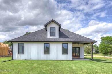 Welcome to 4308 Par Ln, a beautifully designed new construction on Twin Hills Golf and Country Club in Missouri - for sale on GolfHomes.com, golf home, golf lot