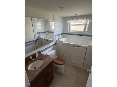 Beautifully updated corner unit 2BR/2BA condo in the desirable on Addison Reserve in Florida - for sale on GolfHomes.com, golf home, golf lot