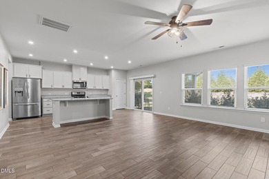 Greeted by a stacked-stone, covered front porch and classic on The Club At Twelve Oaks in North Carolina - for sale on GolfHomes.com, golf home, golf lot