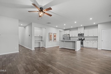 Greeted by a stacked-stone, covered front porch and classic on The Club At Twelve Oaks in North Carolina - for sale on GolfHomes.com, golf home, golf lot