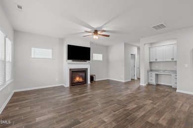 Greeted by a stacked-stone, covered front porch and classic on The Club At Twelve Oaks in North Carolina - for sale on GolfHomes.com, golf home, golf lot