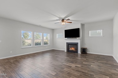 Greeted by a stacked-stone, covered front porch and classic on The Club At Twelve Oaks in North Carolina - for sale on GolfHomes.com, golf home, golf lot