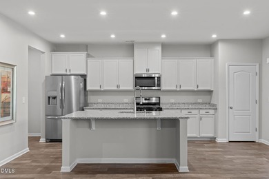 Greeted by a stacked-stone, covered front porch and classic on The Club At Twelve Oaks in North Carolina - for sale on GolfHomes.com, golf home, golf lot