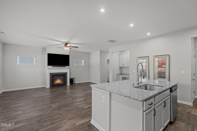 Greeted by a stacked-stone, covered front porch and classic on The Club At Twelve Oaks in North Carolina - for sale on GolfHomes.com, golf home, golf lot