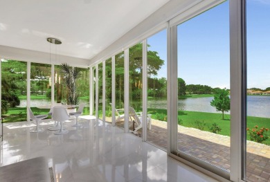 Spectacular contemporary condo features cinematic water views on Broken Sound Golf and Club  in Florida - for sale on GolfHomes.com, golf home, golf lot