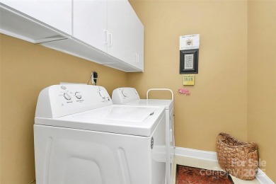 Discover refined living in this elegant full brick home on 3rd on The Palisades Country Club in North Carolina - for sale on GolfHomes.com, golf home, golf lot