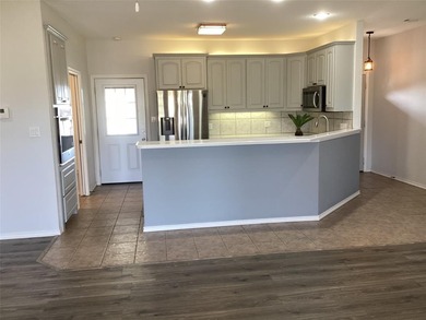 Welcome to this stunning half duplex nestled along the greens of on Holiday Hills Country Club in Texas - for sale on GolfHomes.com, golf home, golf lot