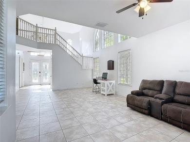 Stunning 5-Bedroom Pool Home on Expansive Corner Lot with Water on Oaks National Golf Course in Florida - for sale on GolfHomes.com, golf home, golf lot