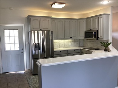 Welcome to this stunning half duplex nestled along the greens of on Holiday Hills Country Club in Texas - for sale on GolfHomes.com, golf home, golf lot