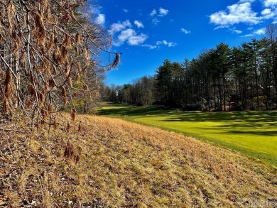 This .57-acre lot nestled on Fairway Drive sits on 4 golf hole on Lake Toxaway Country Club in North Carolina - for sale on GolfHomes.com, golf home, golf lot