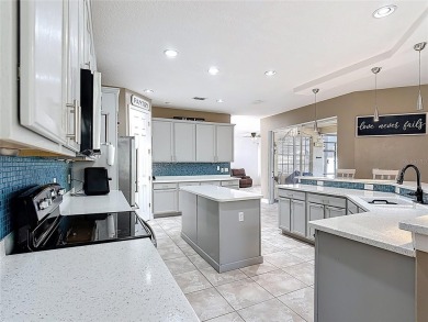Stunning 5-Bedroom Pool Home on Expansive Corner Lot with Water on Oaks National Golf Course in Florida - for sale on GolfHomes.com, golf home, golf lot