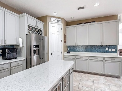 Stunning 5-Bedroom Pool Home on Expansive Corner Lot with Water on Oaks National Golf Course in Florida - for sale on GolfHomes.com, golf home, golf lot